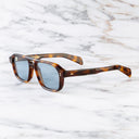 An image of the GR15 Aviator Sunglasses in Havana frame side view with arms open marble background