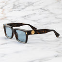 An image of the Palace Cutler and Gross Mercury Square Sunglasses in Havana frame side view with arms open marble background