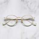 An image of the Lennox 1428 Round Opticals in Gold frame frontal view with arms closed marble background