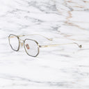 An image of the Lansdowne 1431 Square Opticals in Silver/Black frame side view with arms open marble background