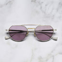 An image of the Draycott 1426 Round Sunglasses in Silver/Gold frame frontal view with arms closed marble background