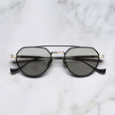 An image of the Draycott 1426 Round Sunglasses in Black/Gold frame frontal view with arms closed marble background