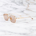 An image of the Cranley 1425 Aviator Sunglasses in Jewel Gold frame side view with arms open marble background