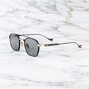 An image of the Cranley 1425 Aviator Sunglasses in Black/Gold frame side view with arms open marble background