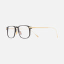 An image of the 0007 Rectangle Opticals in Black on 24K Yellow Gold + 18K Rhodium frame side view with arms open