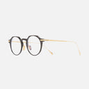 An image of the 0008 Round Opticals in Black on 24K Yellow Gold + 18K Rhodium frame side view with arms open