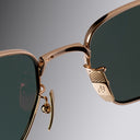 An image of the Breitling Léman 0001 Square Sunglasses Red Gold frame detail close up of bridge
