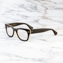 An image of the Cutler and Gross 0772V1 Square Horn Optical in Smoke Brown/Cream Buffalo Horn frame side view with arms open marble background