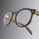 An image of the Cutler and Gross 1378 Round Horn Optical in Smoke Brown/Cream Buffalo Horn frame detail close up from right side view