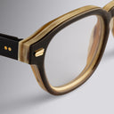 An image of the Cutler and Gross 9290 Round Horn Optical in Smoke Brown/Cream Buffalo Horn frame detail close up of left hinge and temple