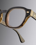 An image of the Cutler and Gross 9290 Round Horn Optical in Smoke Brown/Cream Buffalo Horn frame detail close up of right lens and temple
