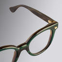 An image of the Cutler and Gross 9298 Round Horn Optical in Moss Green/Brown Buffalo Horn frame detail close up of right hinge and temple