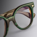 An image of the Cutler and Gross 9298 Round Horn Optical in Moss Green/Brown Buffalo Horn frame detail close up of right lens