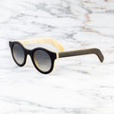 An image of the Cutler and Gross 0737 Round Horn Sunglass in Deep Matte Black/Cream Buffalo Horn frame side view with arms open marble background