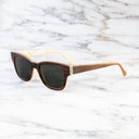 An image of the Cutler and Gross 0772 Square Horn Sunglass in Toffee Brown/Cream Buffalo Horn frame side view with arms open marble background