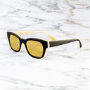 An image of the Cutler and Gross 0772 Square Horn Sunglass in Deep Matte Black/Cream Buffalo Horn frame side view with arms open marble background
