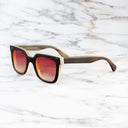 An image of the Cutler and Gross 4469 Square Horn Sunglass in Smoke Brown/Cream Buffalo Horn frame side view with arms open marble background