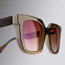 An image of the Cutler and Gross 4469 Square Horn Sunglass in Smoke Brown/Cream Buffalo Horn frame detail close up of left lens and right temple
