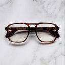 An image of the 1394 Aviator Optical in Dark Turtle frame frontal view with arms closed marble background