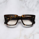An image of the 1401 Cat Eye Opticals Brush Stroke frame frontal view with arms closed Marble background