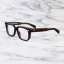 An image of the 1410 Square Optical (Large) in Dark Turtle frame side view with arms open marble background