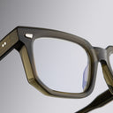 An image of the 1410 Square Optical (Large) in Olive frame detail close up of left lens and hinge