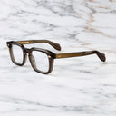An image of the 1416 Square Optical in Brown Crystal frame side view with arms open marble background