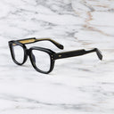 An image of the 1433 Square Optical in Black frame side view with arms open marble background