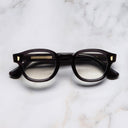An image of the 9290 Round Opticals in Dark Grey frame frontal view with arms closed marble background
