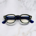 An image of the 9290 Round Opticals in Emerald Marble on Ink Colour Studio frame frontal view with arms closed marble background