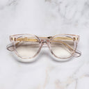 An image of the 9298 Cat Eye Opticals in Nude Pink frame frontal view with arms closed marble background