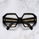 An image of the 9324 Square Opticals in Black on Crystal frame frontal view with arms closed marble background