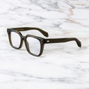 An image of the Cutler and Gross 9387 Square Optical frame in Olive frame side view with arms open marble background.