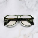 An image of the 9782 Aviator Opticals in Joshua Green frame frontal view with arms closed marble background