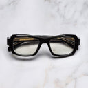 An image of the 9894 Rectangle Opticals in Black frame frontal view with arms closed marble background