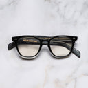 An image of the GR05 Cat Eye Optical Glasses in Black on Horn frame frontal view with arms closed marble background