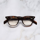 An image of the GR05 Cat Eye Optical Glasses in Dark Turtle frame frontal view with arms closed marble background