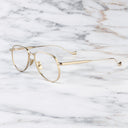 An image of the Pembroke 1429 Aviator Opticals in Gold frame side view with arms open marble background