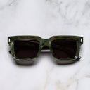 An image of the 1386 Square Sunglasses in Emerald Marble frame frontal view with arms closed marble background