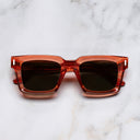 An image of the 1386 Square Sunglasses in Watermelon Crystal frame frontal view with arms closed marble background