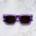 An image of the 1386 Square Sunglasses in Orchid Crystal frame frontal view with arms closed marble background