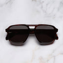 An image of the 1394 Aviator Sunglasses in Nolita Havana frame frontal view with arms closed marble background