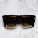 An image of the 1414 Rectangle Sunglasses in Black on Havana frame frontal view with arms closed marble background