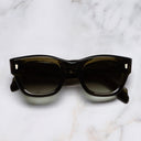 An image of the 9261 Cat Eye Sunglasses in Olive frame frontal view with arms closed marble background