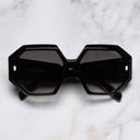 An image of the 9324 Square Sunglasses in Black frame frontal view with arms closed marble background