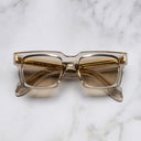 An image of the 9386 Square Sunglasses in Sand Crystal frame frontal view with arms closed marble background