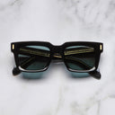 An image of the 9386 Square Sunglasses in Black frame frontal view with arms closed marble background