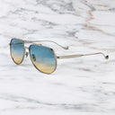 An image of the Sloane 1423 Aviator Sunglasses in Gun Metal frame side view with arms open marble background