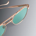 An image of the Draycott 1426 Round Sunglasses Jewel Gold frame side view with arms folded