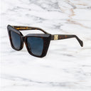 An image of the Cutler and Gross Valentina 002 Cat Eye Tortoiseshell Sunglasses with Blue lenses frame side view with arms open and gold details on temples.